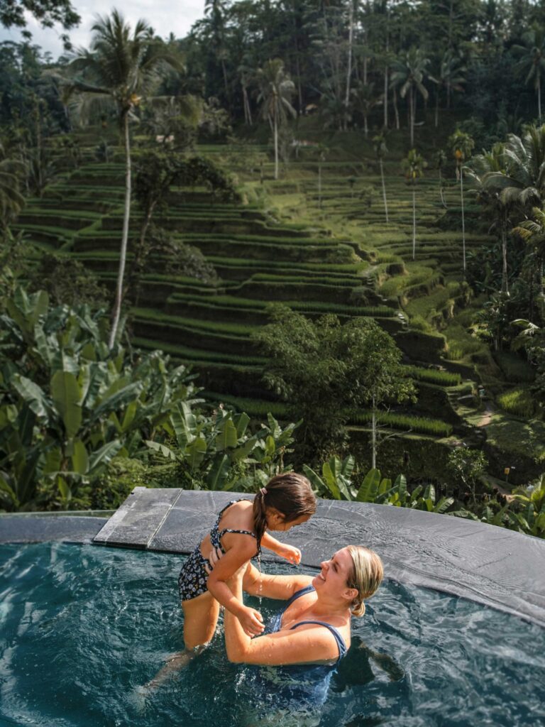 woman and child enjoying the pool
